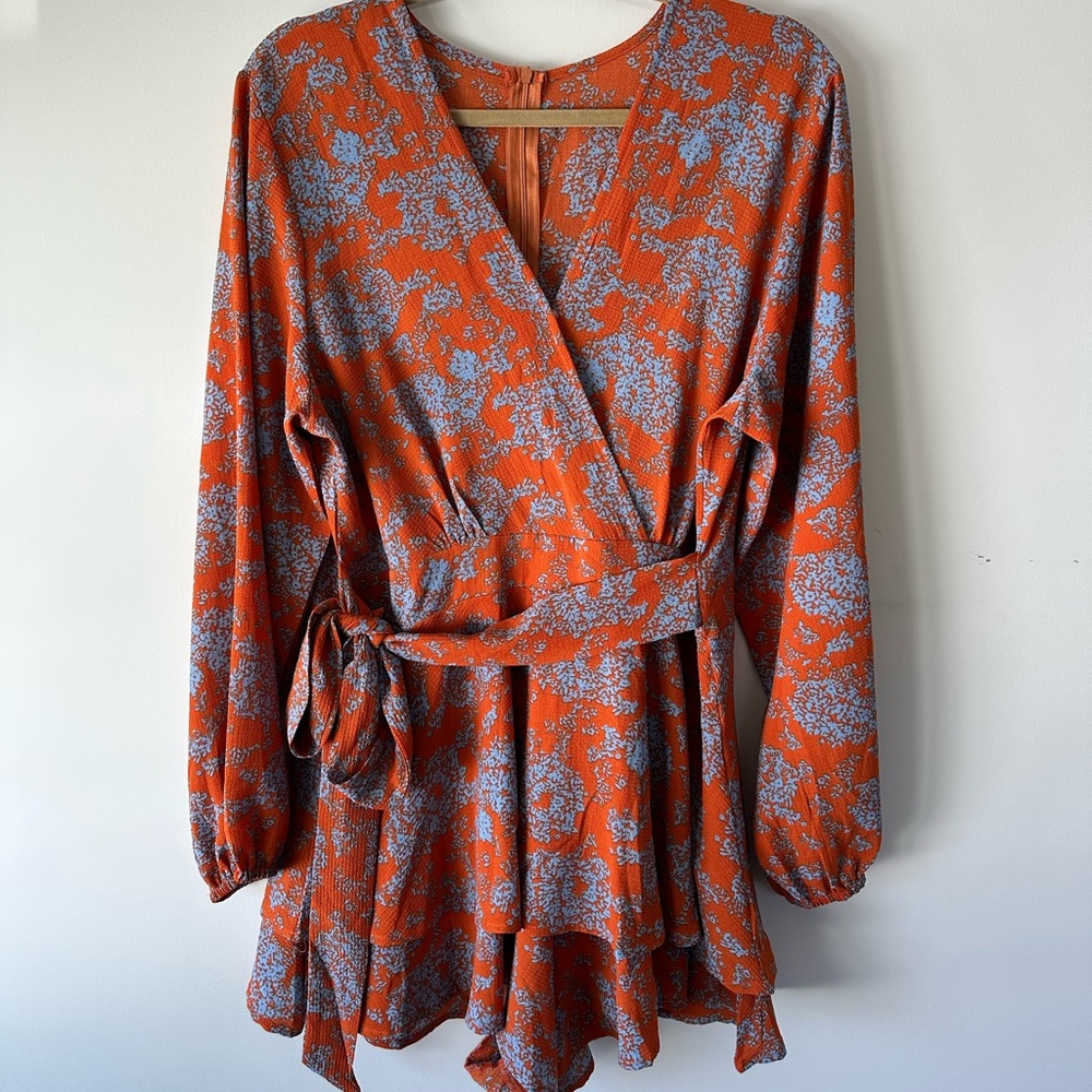 Floral style romper, size Large.